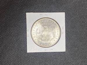 1886 Morgan Silver Dollar marked MS63 when purchased