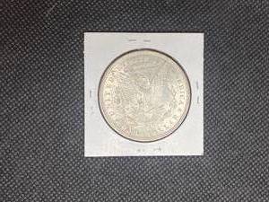 1896 Morgan Silver Dollar marked MS63 when purchased