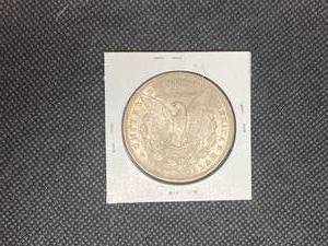 1898 Morgan Silver Dollar marked MS63 when purchased