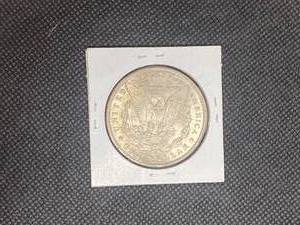 1900-O Morgan Silver Dollar marked MS63 when purchased