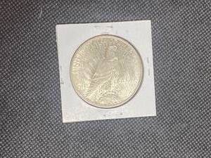 1922-D Peace Silver Dollar  marked MS63 when purchased