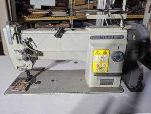 lot 21 image: Mitzi YU360CTS Single Needle Unison feed walking foot machine (with table motor & Stand)
