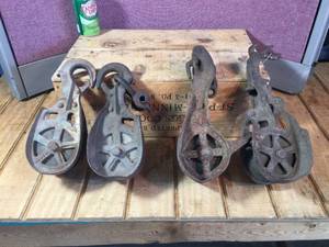 lot 102 image: 4 Antique Barn Pulleys