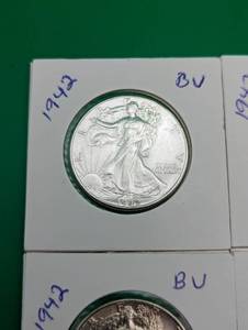 Four 1942 Walking Liberty Silver Half Dollars