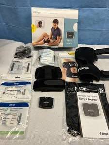 lot 21 image: MSRP $800 NEW OPEN BOX Empi Active Knee TENS Device -&nbspdelivers a proprietary TENS waveform to the knee to manage acute, chronic, and arthritic pain while minimizing interruption of daily activities.