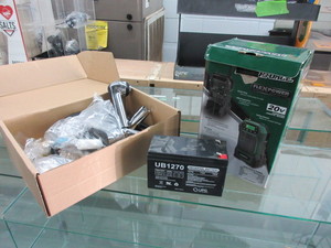 lot 859 image: RADIO, FAUCET AND A UNIVERSAL BATTERY - ALL NEW