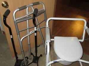 lot 168 image: Portable Commode, folding walker and claw foot style walking cane grouping