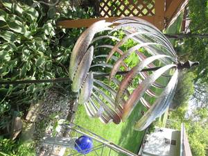 lot 199 image: Metal wind spinner on a stand