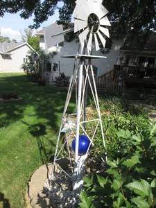 lot 201 image: Windmill, gazing ball and stand