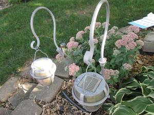 lot 203 image: 2 Hanging solar lamps