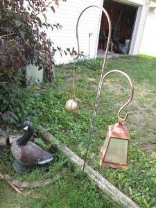 lot 215 image: Shepherds hook with decor and a cement goose