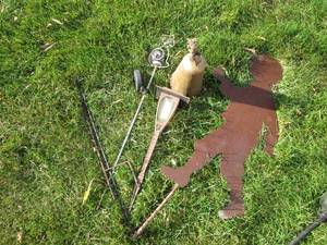 lot 233 image: Cut metal firefighter boy, puppy orb, cowbell and light lawn decor