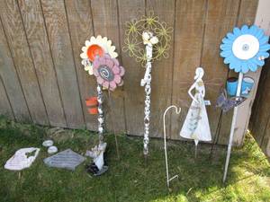 lot 235 image: Angel and flower themed metal yard markers along with memorial stepping stones