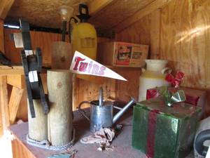 lot 243 image: Metal milk and watering cans, Large wood Twins bear themed lawn ornament with other yard decor as well as a manual pump sprayer and shooting targets