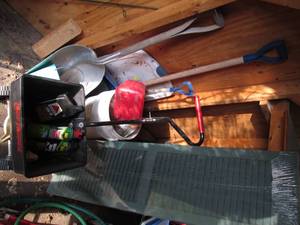 lot 245 image: New window shutters. true temper spreader, yard chemicals, assorted shovels and more