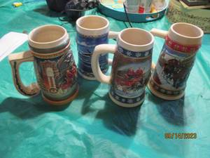 lot 121 image: Collection of (4) Budweiser Holiday Steins