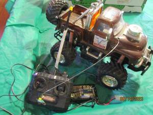 lot 128 image: Remote control Desperado Lifted RC truck with battery and wall adapter