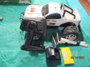 lot 129 image: Remote control RC car with battery and wall adapter