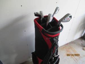 lot 70 image: PowerBilt golf clubs with a really nice golf bag including zip cover