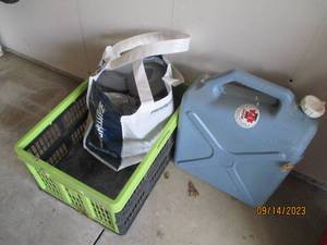 lot 72 image: Crate of solar yard lights and watering can