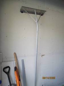 lot 83 image: Metal roof rake with extention poles