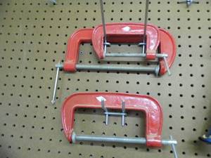 lot 50 image: Pair of large c-clamps with a single, slightly smaller c-clamp
