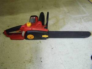 lot 63 image: Homelite UT43120 electric chainsaw with cover