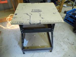 lot 67 image: Metal framed portable work bench. In addition to the work surface, includes 2-tiers of storage space