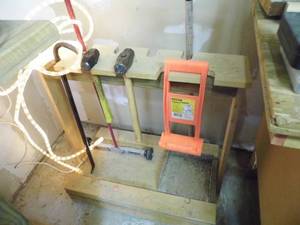 lot 68 image: Wood framed free standing Shop rack with content including a magnetic shop sweeper