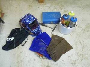 lot 268 image: Tons of soldering and welding supplies including an Americana themed welding helmet