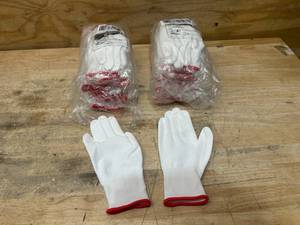 lot 52 image: PIP Lot of 2 Packs of Seamless Knit Polyester Gloves with Polyurethane Coated Grip (12 pairs per pack) Size Small
