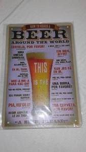 lot 543 image: New Beer Around The World Metal Sign.