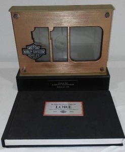 lot 560 image: Harley-Davidson Picture Frame and Harley-Davidson Lore 1903-1965.