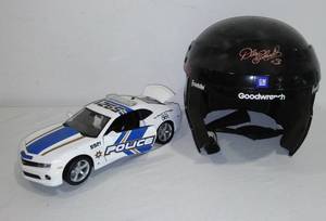 lot 610 image: Maisto Chevrolet Camaro Hornet Police Car and Dale Earnhardt Helmet.