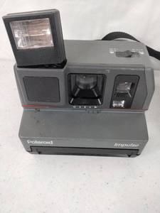 lot 315 image: Pair of Vintage Polaroid Cameras Polaroid Impulse, Polaroid Sun 600