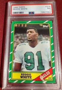 lot 145 image: 1986 Topps Reggie White Rookie Card - PSA 7