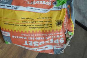 lot 127 image: Half Full Bag of Speedset Fortified Thin-Set  Mortar
