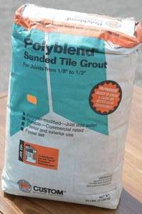 lot 35 image: Unopened Bag of Polyblend Sanded Tile Grout