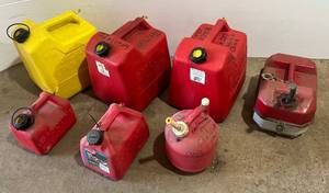 lot 37 image: Misc. Plastic Gas Cans & 1 Metal Gas & Tool Box All In One & Rubbermaid Trash Can