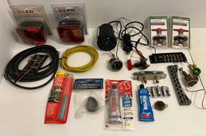 lot 52 image: Misc. Marine electronics Including In-Dash Lowrance Depth Finder, Fuse Blocks, (Led Submersibel Stop,Turn, Tail Lights) (NIB) & More