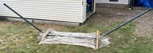 lot 10 image: Hammock With Collapsible Metal Frame (Needs Hooks And Rope To Hang Hammock)