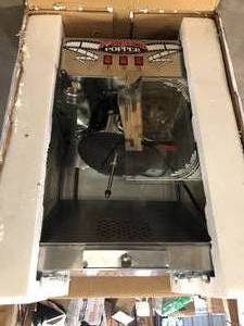 lot 4 image: Commercial 16 oz. Majestic Silver Countertop Popcorn Machine by  Superior Popcorn Company Costumer Returns See Pics