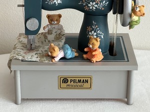 lot 29 image: Pelman Sewing Machine Musical Figurine Plays The Love Story