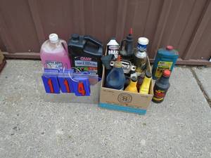 Assortment of automotive chemicals & bar & chain oil. As shown.