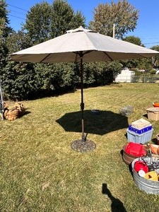lot 40 image: 8 Beige Patio Umbrella with Metal Stand