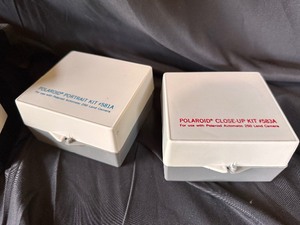lot 111 image: Vintage Original Polaroid SX-70 OneStep White Rainbow Stripe Land Camera with Case, Close Up and Portrait Kits, and Polacolor Print Mounts