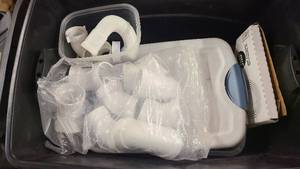 Tote of electrical and plumbing supplies
