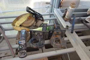 lot 111 image: 2 pintle hitches 1 drop hitch bottle jacks straps and tarp