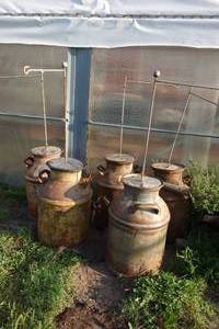 lot 152 image: Milk Cans with flag holder tops
