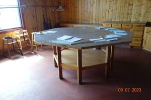 lot 53 image: Octagon Table 8 across 41 tall. breaks down into 2 pieces